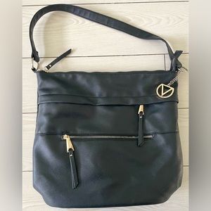 Dolce Vita black tote/purse with gold zippers. Two front zip‎ pockets and V logo
